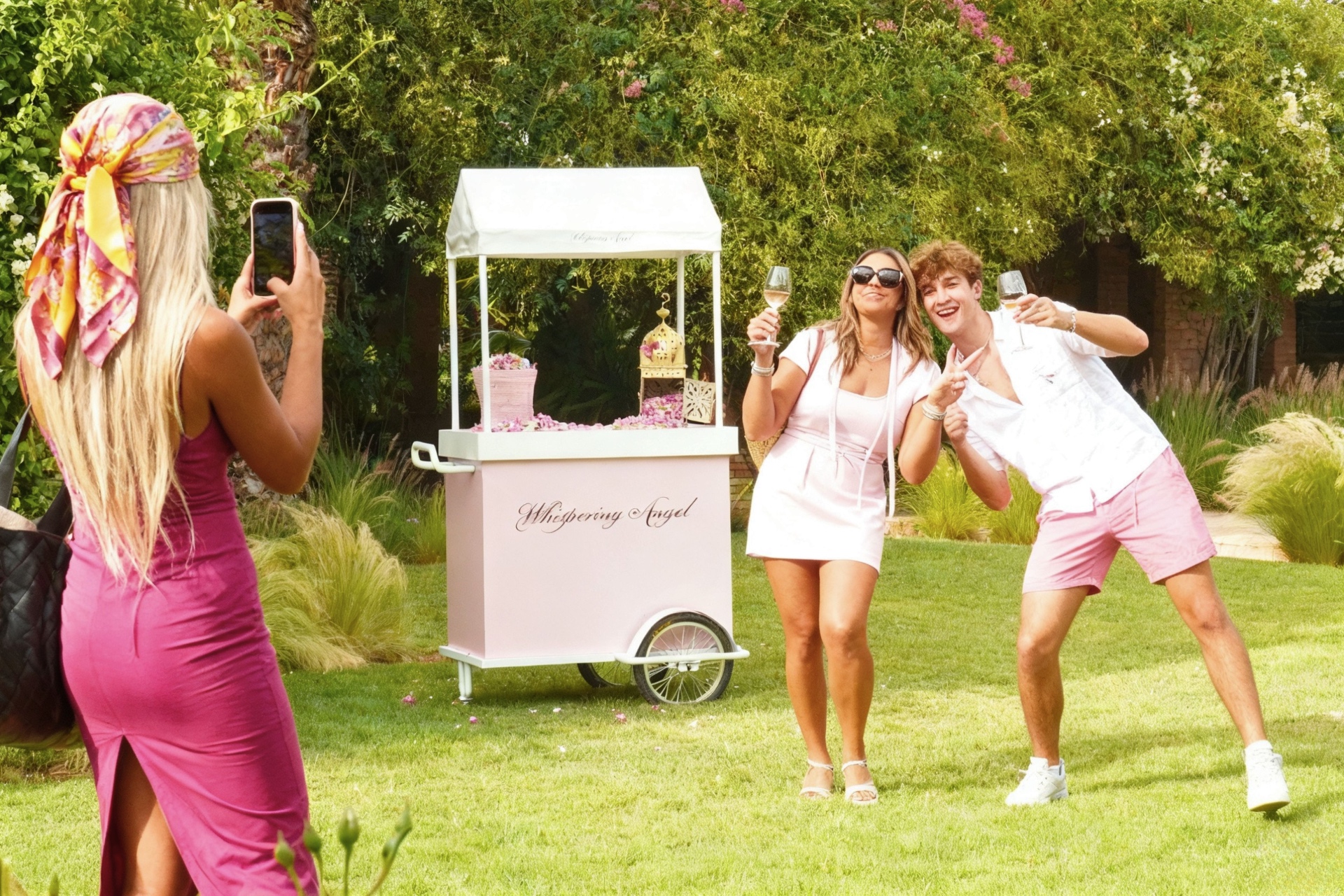 Rosé Days festival guests with Whispering Angel cart in Marrakech garden